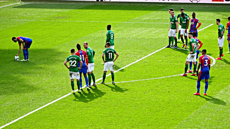 Luka prepares to score from the spot while Wilf appears to share a joke with former team-mate Glenn 