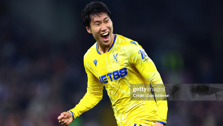 Kamada celebrates scoring the winning goal