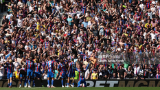 Eze celebrates his second goal in front of the Palace supporters