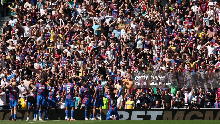 Eze celebrates his second goal in front of the Palace supporters