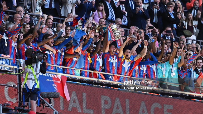 Joel Ward lifts the FA Cup trophy