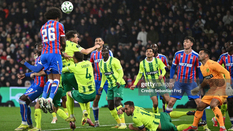 Richards towers over the defenders missing a chance from a corner