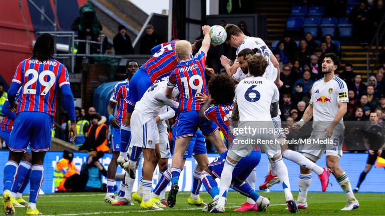 Hughes handballs in the box for Leeds' eventually missed penalty