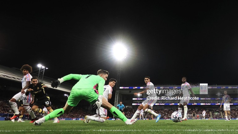 Cherki slots it past Henderson for his first of the night