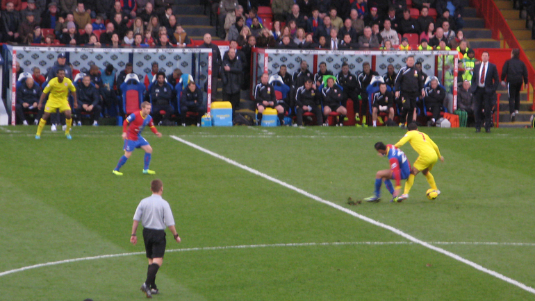 Marouane Chamakh grapples with the Cardiff defence and later scored Palace's second in a 2-0 win