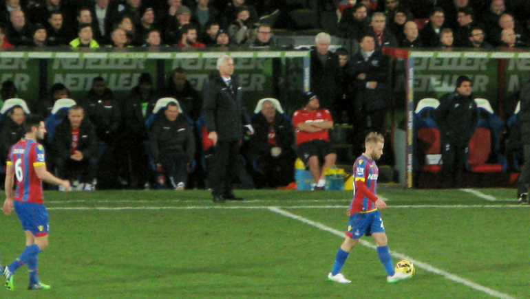 Alan Pardew in characteristic position for his home managerial debut against Tottenham Hotspur