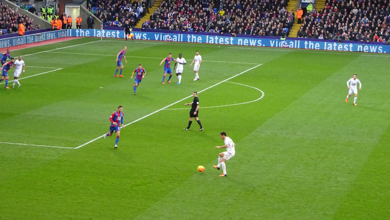 Swansea on the offensive as Yohan Cabaye runs to stifle an attack during the goalless draw.