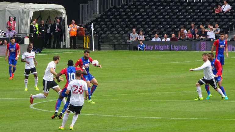 Bolasie and Jedinak tussle for possession as Fulham attack Palace at the Putney end