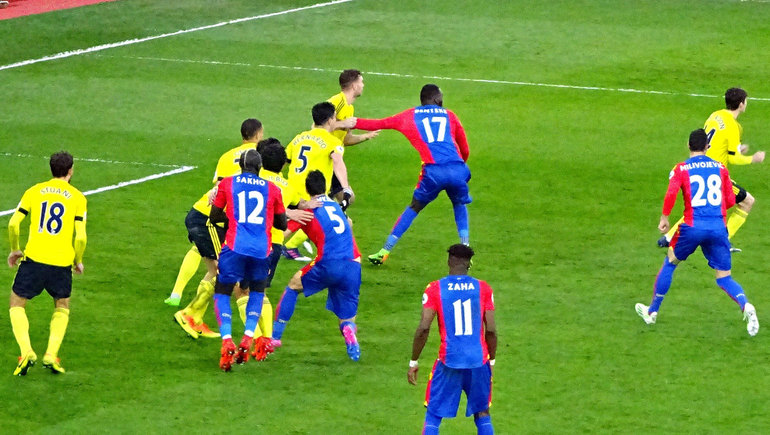 Benteke holds off a Boro defender as the Eagles attack the Holmesdale end