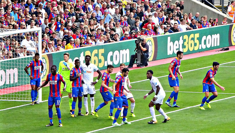 Eagles defend at the Holmesdale End in a scrappy match versus Swansea