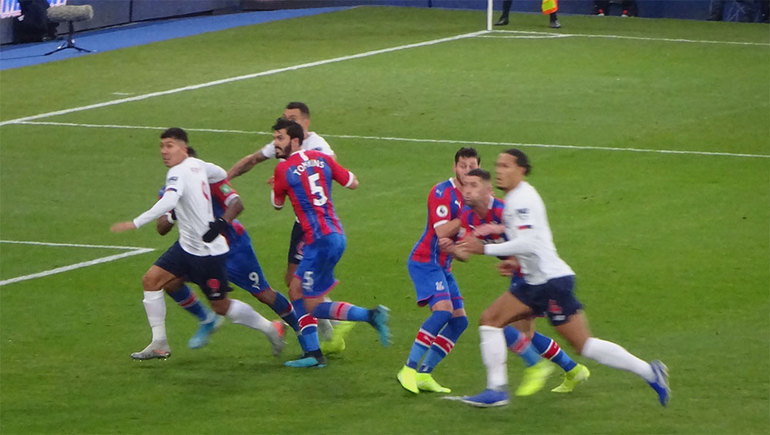 James Tomkins, whose header was disallowed by VAR, tussles with Liverpool attackers