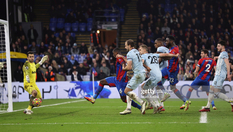 Olise scores Palace's second goal with a free kick which sails into the net.