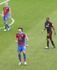 Man in the mask... Eagles captain Mile Jedinak faces up to Middlesbrough