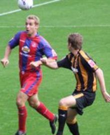 Jamie Scowcroft gets away from Hull's Michael Turner