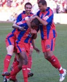 Leon Cort celebrates with team-mates after scoring against Ipswich