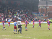 Clarke and Mullins talk tactics, while the other players prepare themselves