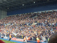 West Brom fans celebrate their first goal.