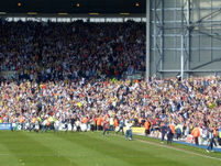 Some West Brom fans run on to the pitch after Bob Taylor scores their second goal.