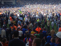 Fans on the pitch.