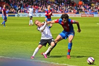 Jedinak fights for the ball.jpg