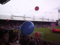 Hundreds of balloons are set off as the players take to the pitch
