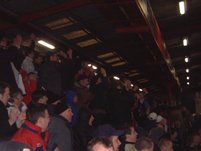 The travelling support celebrate Freedman's late goal