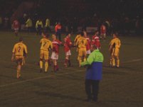 Players shake hands after the match