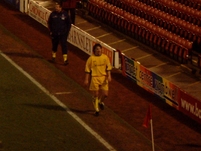Craig Harrison walks down the touchline towards the tunnel, after getting sent off