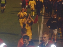 The players applaud the fans after the match