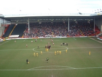 The players warm-up before the start of the match