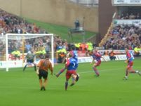Mark Kennedy is closed down by the Palace defence.