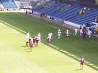 The players leave the pitch at the end of the game