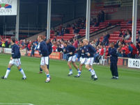 The players warmup before the start of the game