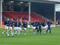 The players perform their warmup routine