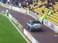 A car is paraded around the pitch at half time!