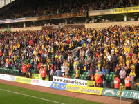 The Norwich fans watching the game