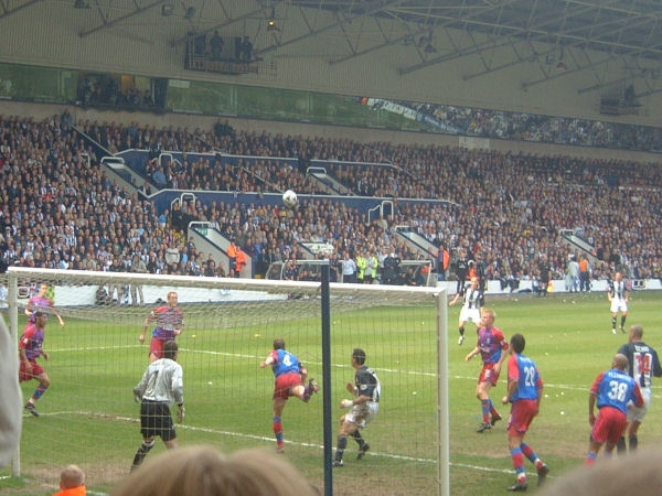 Dean Austin gets a header clear