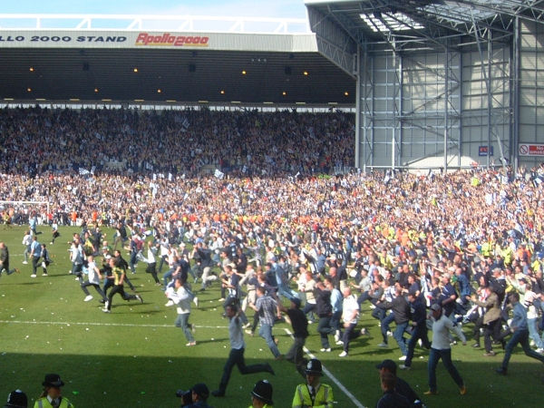 The final whistle blows and thousands of West Brom fans take to the pitch in celebration of their promotion to the Premiership.