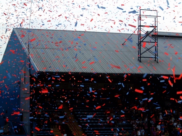 The Holmesdale Road end is covered in shower of Red and Blue ticker