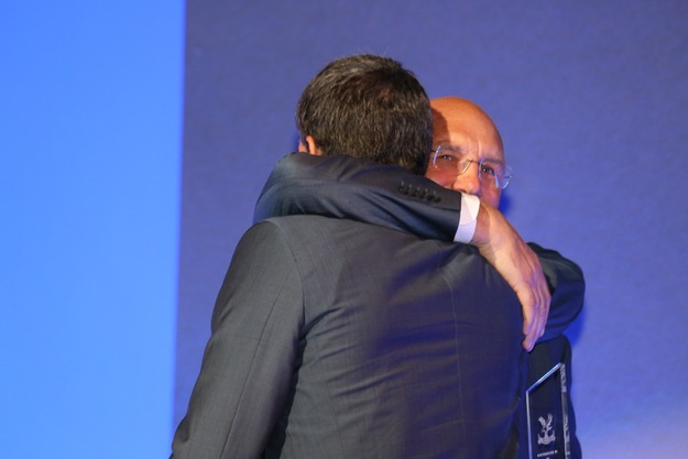 Julian Speroni gets a hug from goalkeeper coach George Wood