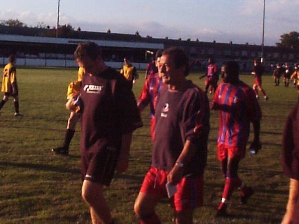 Steve Kember and the rest of the team go off for a half time teamtalk