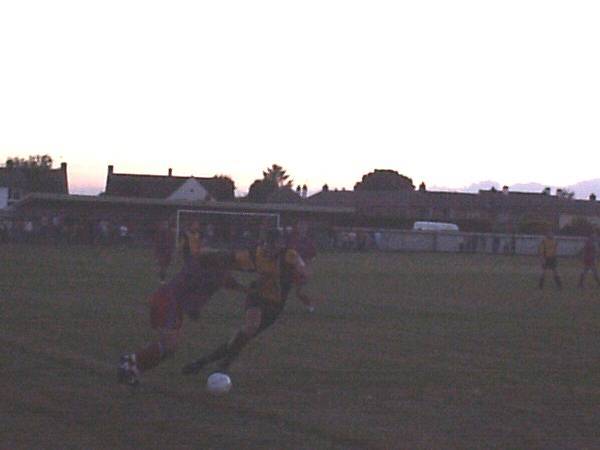 Players battle down the wing