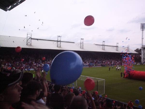 Hundreds of balloons are set off as the players take to the pitch