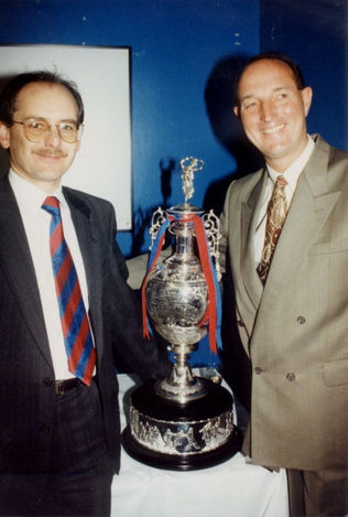 andy_the_eagle with two slightly better known characters from Palace's recent history. It's just after the end of the 93-94 season and Mr. Smith has much to be happy about, proudly showing off the 1st Division Championship Cup. If I remember rightly the occasion was just prior to a Sportsman Dinner at the club where we were entertained by Big Mal and The Doc.