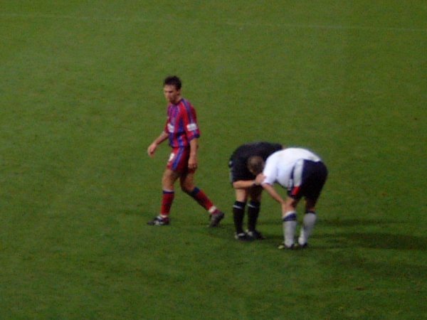 Dougie Freedman looks on as a Bolton player gets attention from the Ref.
