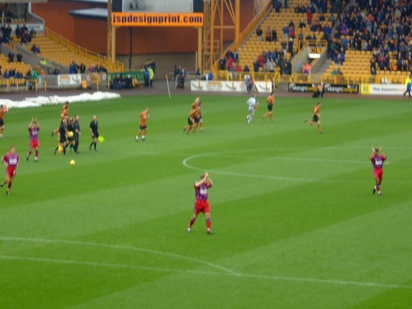 Players applaud the Palace travelling support