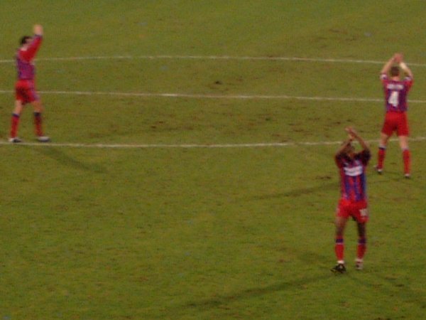 Palace players applaud the crowd after the match