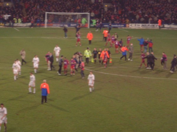 Players shake hands after the game