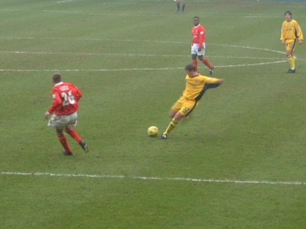 Jamie Pollock gets in a shot