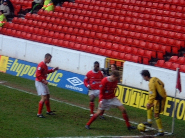 Dougie Freedman is closed down by three Forest players
